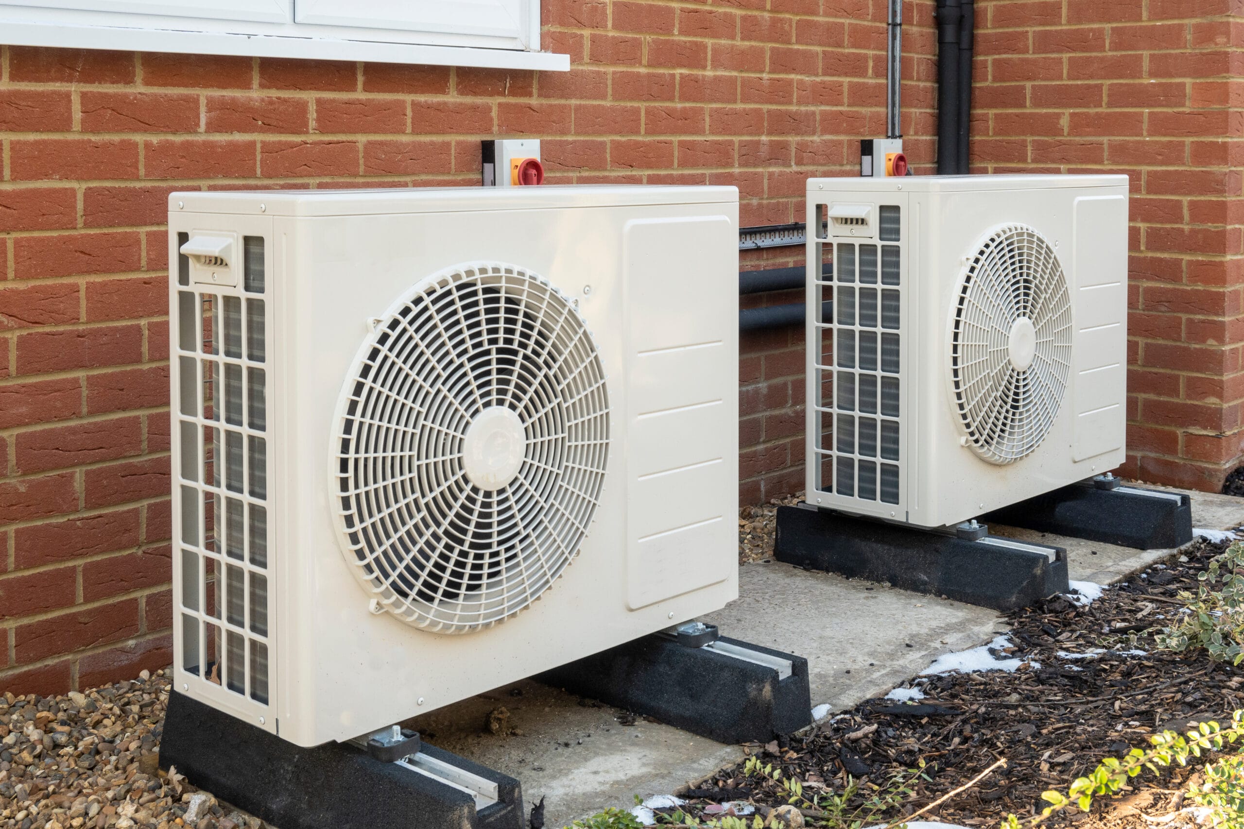 two,air,source,heat,pumps,installed,on,the,exterior,of
