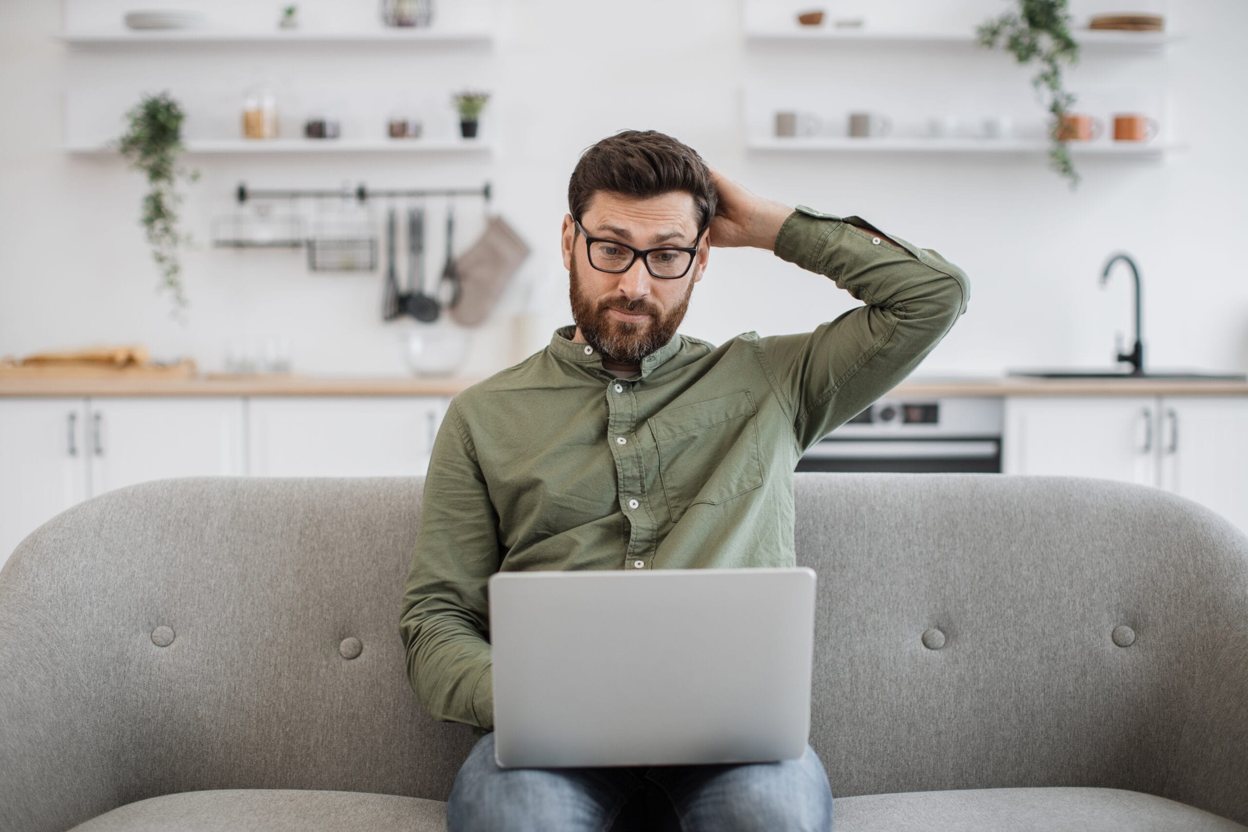 confused,bearded,male,wearing,eyeglasses,and,casual,attire,shrugging,shoulders