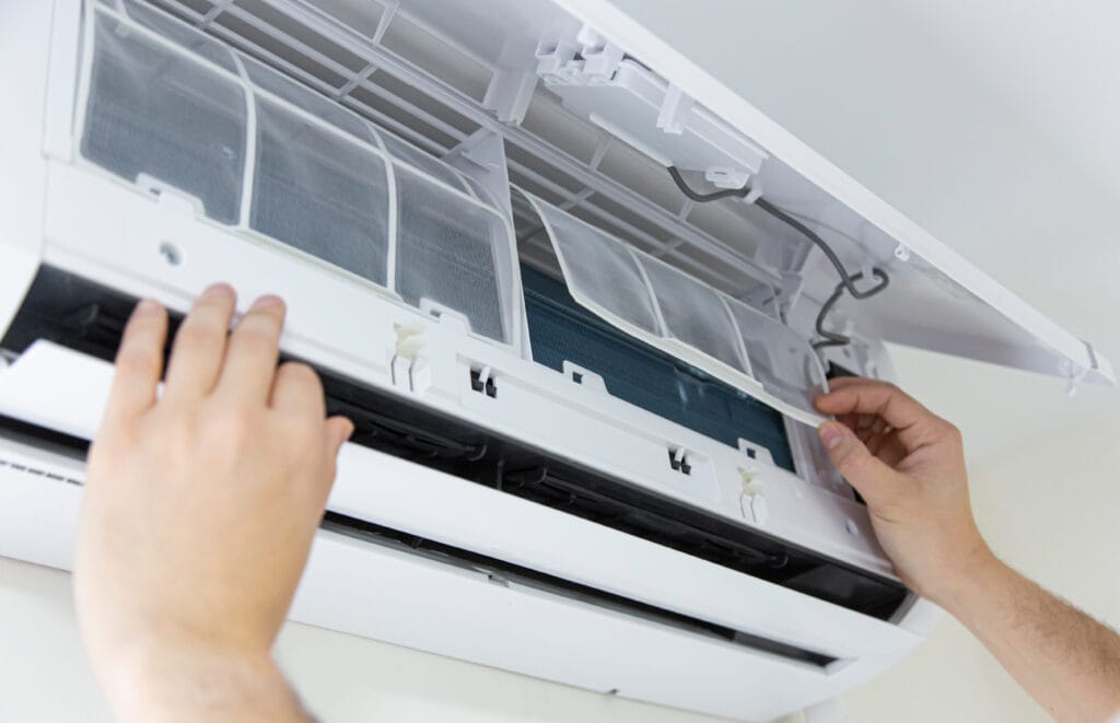 male,technician,cleaning,air,conditioner,indoors.,technician,service,cleaning,the